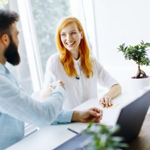 business-people-shaking-hands-and-finishing-up-a-meeting-e1658482730164.jpg